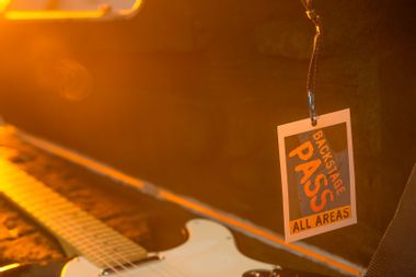 Backstage pass with guitar