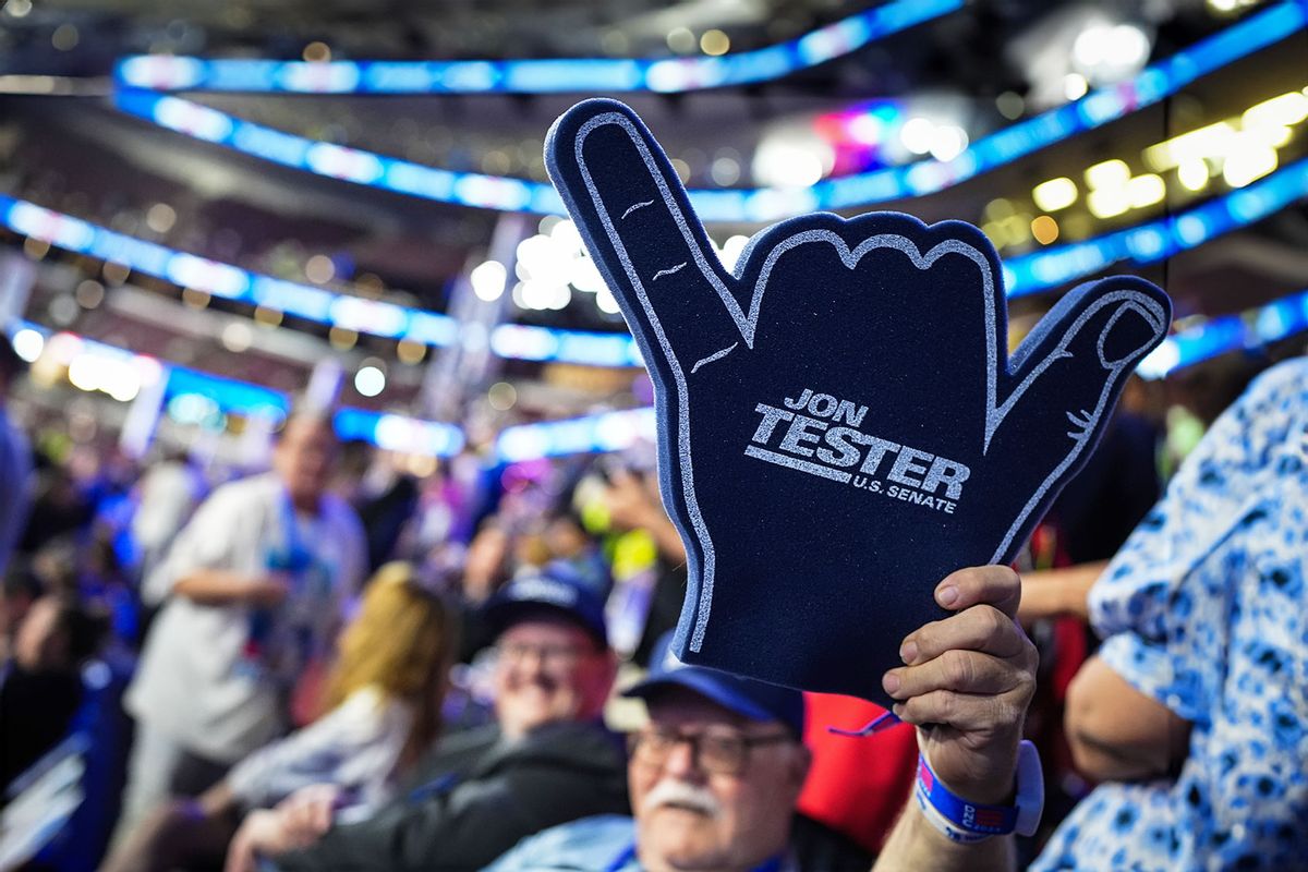 An attendee holds up sign supporting U.S. Sen. Jon Tester (D-MT) during the second day of the Democratic National Convention at the United Center on August 20, 2024 in Chicago, Illinois. (Andrew Harnik/Getty Images)